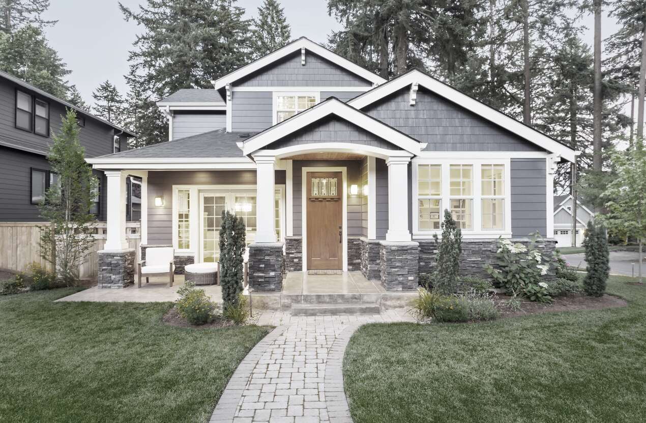 Front of a house at night from the perspective of someone with achromatopsia. Second of five stages.  