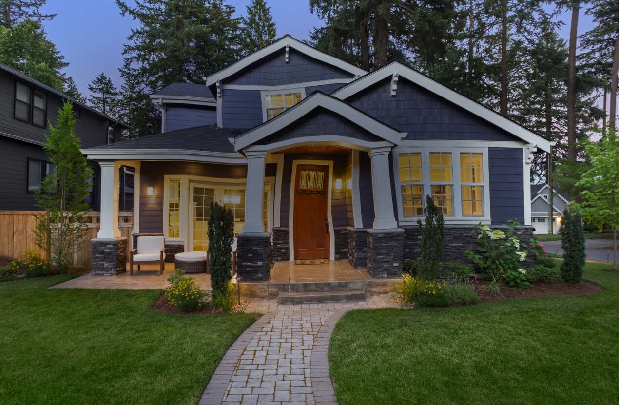 Front of a house at night from the perspective of someone with age-related macular degeneration. Second of five stages.