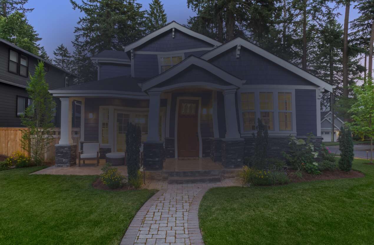 Front of a house at night from the perspective of someone with age-related macular degeneration. Third of five stages.