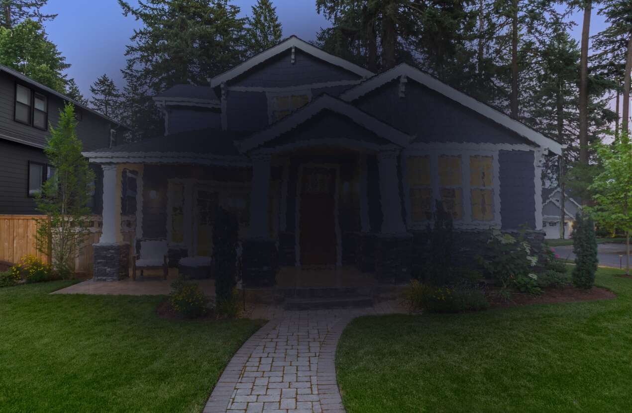 Front of a house at night from the perspective of someone with age-related macular degeneration. Fourth of five stages.