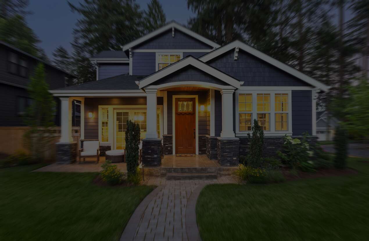 Front of a house at night from the perspective of someone with choroideremia. First of five stages.