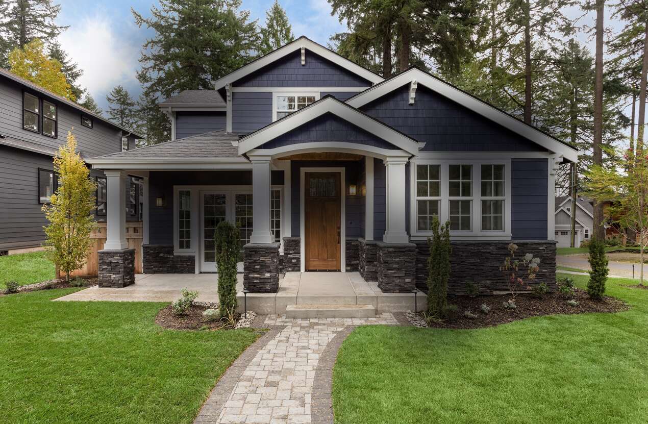 Front of a house in daylight from the perspective of someone with Stargardt disease. First of five stages.