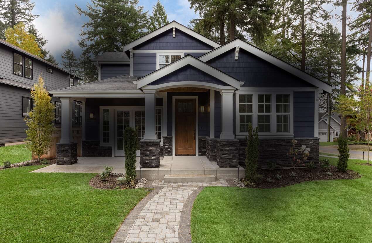 Front of a house in daylight from the perspective of someone with Stargardt disease. Second of five stages.