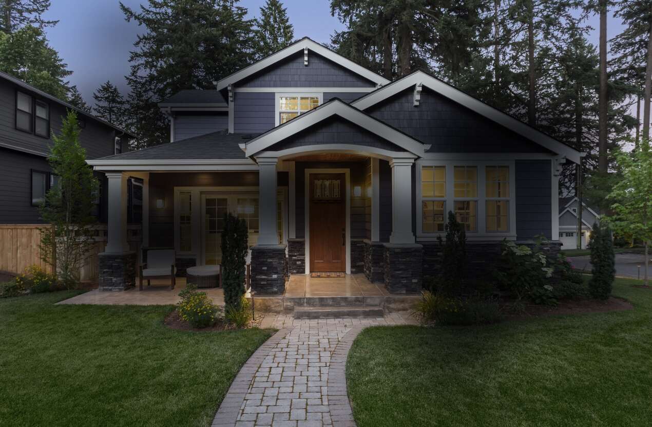 Front of a house at night from the perspective of someone with Stargardt disease. Second of five stages.