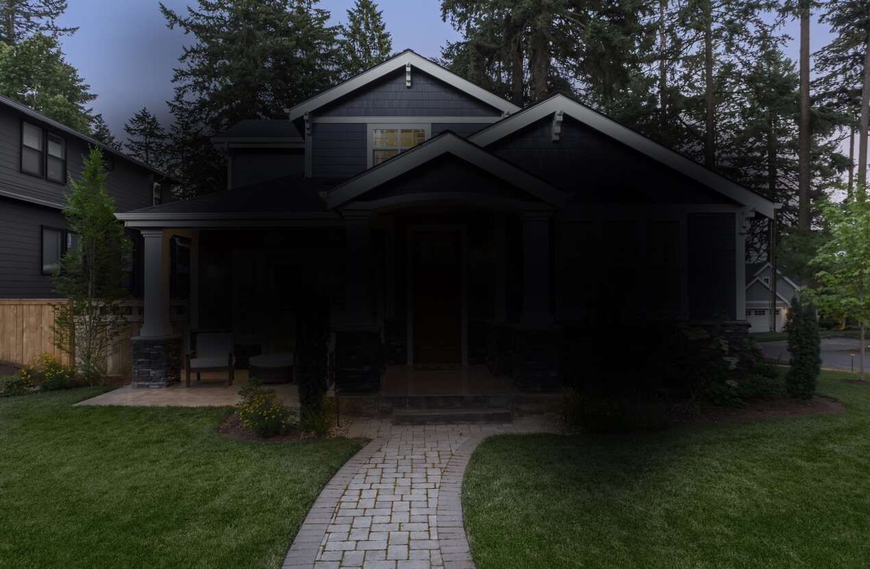 Front of a house at night from the perspective of someone with Stargardt disease. Fourth of five stages.
