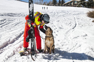 Chad and his guide dog, Sarge in the snow at Snowmass