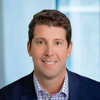 headshot of Jeff Klaas, Chief Strategy and Innovation Officer, wear blue jacket with white and dark blue plaid shirt
