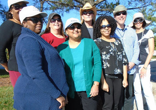 Members of the Foundation Fighting Blindness staff wearing sunglasses.