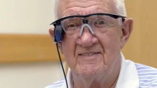 Photo of Ray Flynn wearing the Argus II retinal prosthetic